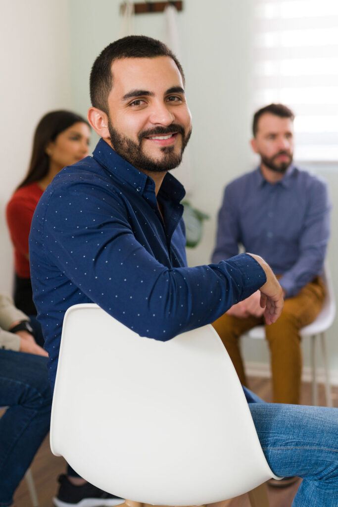 Addiction Treatment and Therapy for College Students Group therapy session for college students in addiction recovery